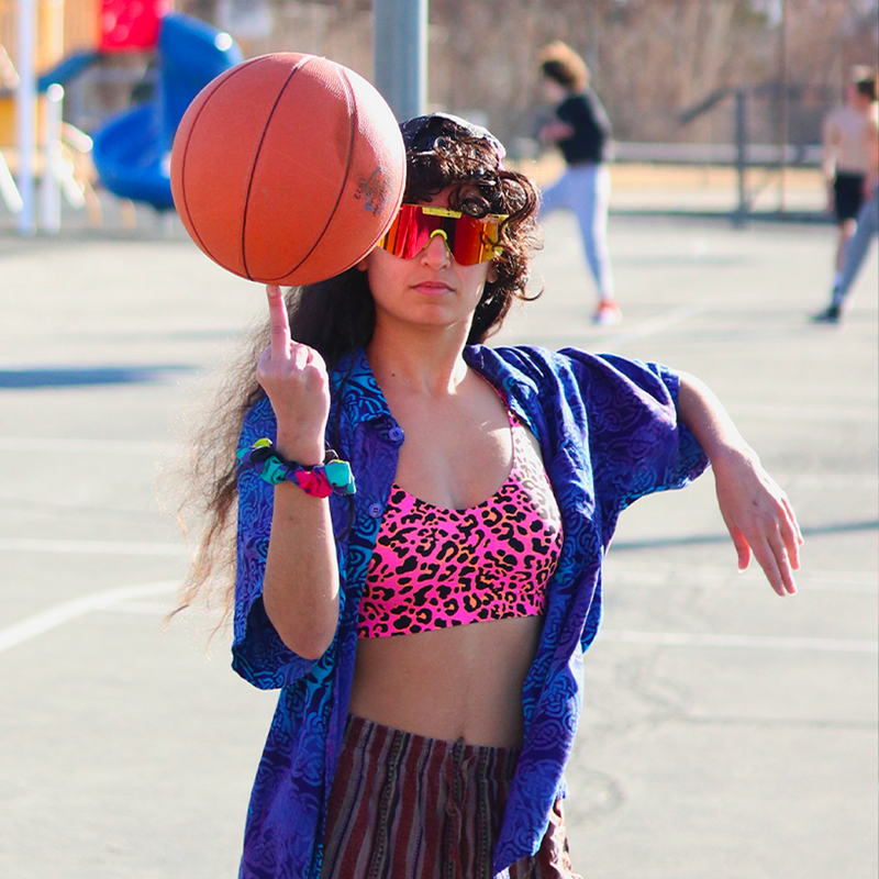 / Polarized Rainbow | photo_for_website.JPG | Woman twirling basketball wearing Pit Viper Sunglasses