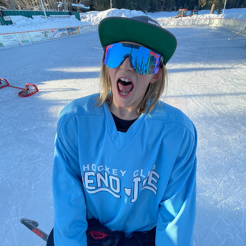 Polarized Blue / Wide | you_want_to_buy_this.JPG | Kid on an ice rink posing in the The Basketball Team Original from Pit Viper Sunglasses