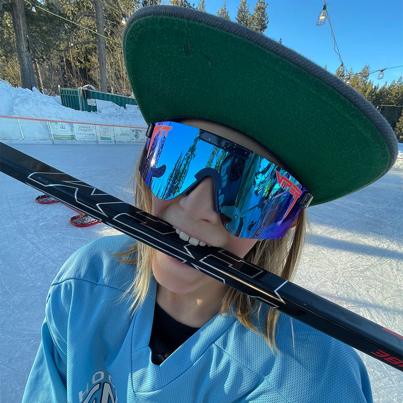Polarized Blue / Wide | no_not_this_image.JPG | Kid with a hockey stick in his mouth wearing the The Basketball Team Original from Pit Viper Sunglasses
