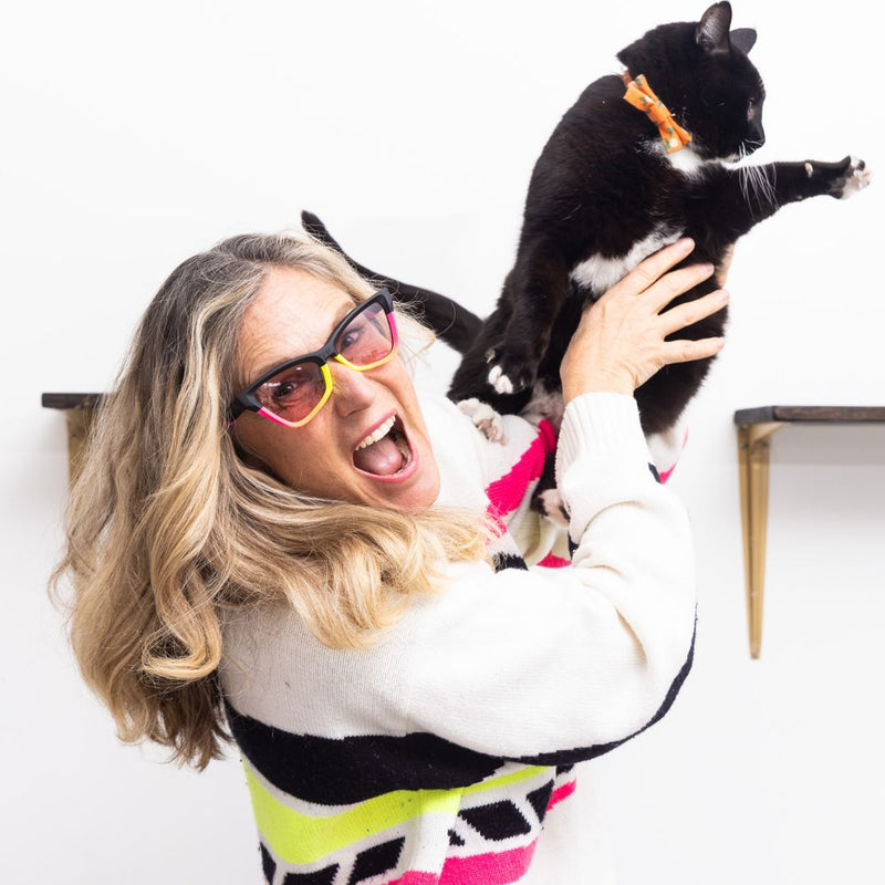 Photochromic Rose | photo_of_person_2.JPG | Womens holds cat while wearing The Italo Clawdia with a photochromic rose lens from Pit Viper