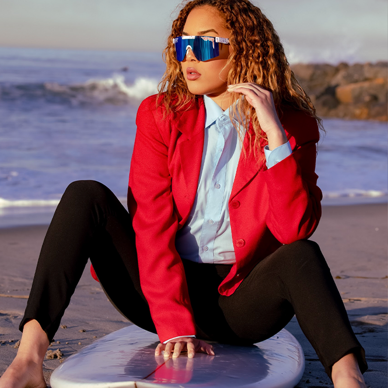/ Polarized Blue / Z87+ Blue | this_one_actually.JPG | Woman posing on surfboard wearing Pit Viper Sunglasses