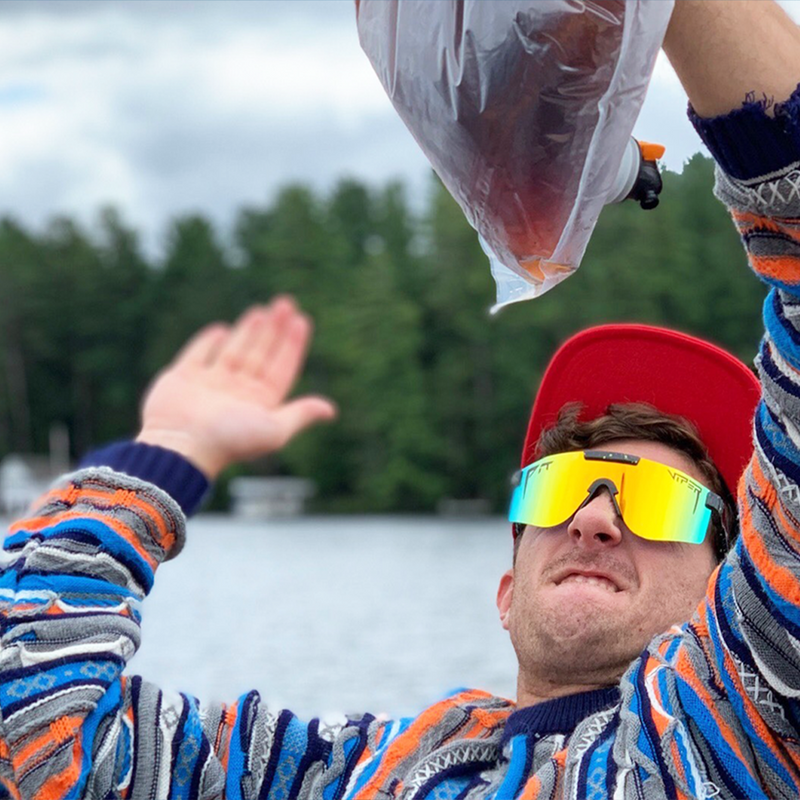 Polarized Orange / Wide | photo_of_person_2.JPG | Man slapping a wine bag wearing The Monsterbull Original from Pit Viper Sunglasses