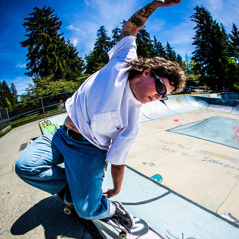 /Smoke | photo_of_person.JPG | Woman skateboarding wearing Pit Viper Sunglasses