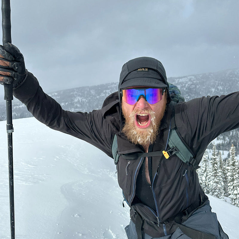 /Smoke | photo_of_person_2.JPG | Man in the snow wearing The Exec Try-Hard from Pit Viper Sunglasses